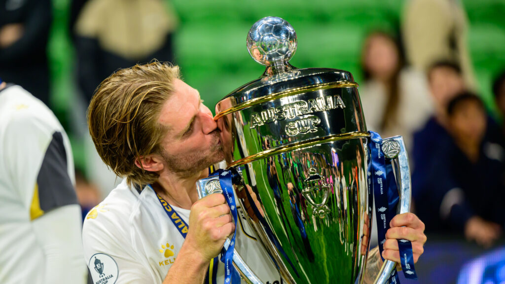 Luke Brattan celebrates winning the 2024 Australia Cup. Marcus Robertson / Round Ball Australia