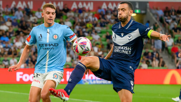 Roderick Miranda and Max Caputo battling it out in the third Melbourne Derby of the season. Photo: Marcus Robertson / Round Ball Australia.