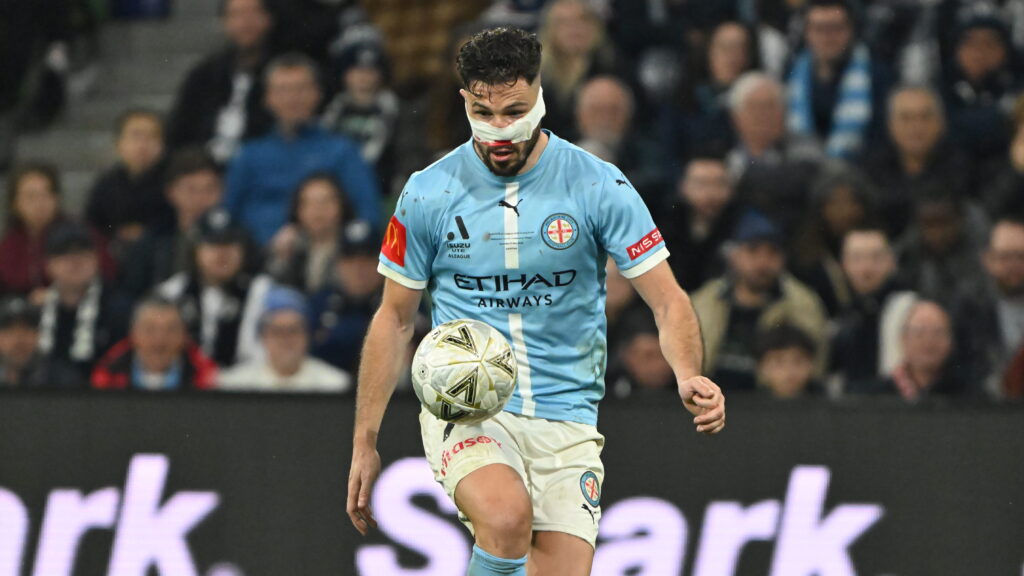 Mat Leckie refused to be substituted despite his nose and his hamstring causing him issues. Photo: Marcus Robertson / Round Ball Australia.
